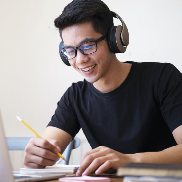 Male student wearing headphones