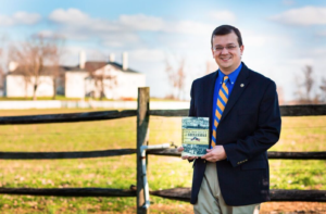 (Professor Noyalas is pictured in front of Belle Grove Plantation holding his most recent book:  Civil War Legacy in the Shenandoah:  Remembrance, Reunion, and Reconciliation.)