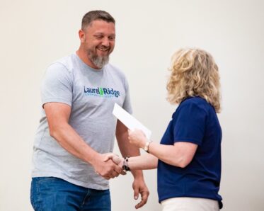 man shaking hands with women