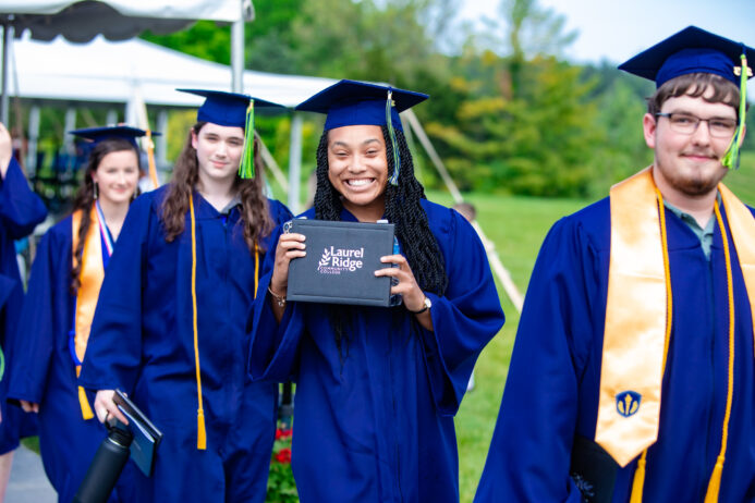 Graduates with diplomas