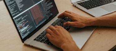 photo of hands using a computer keyboard