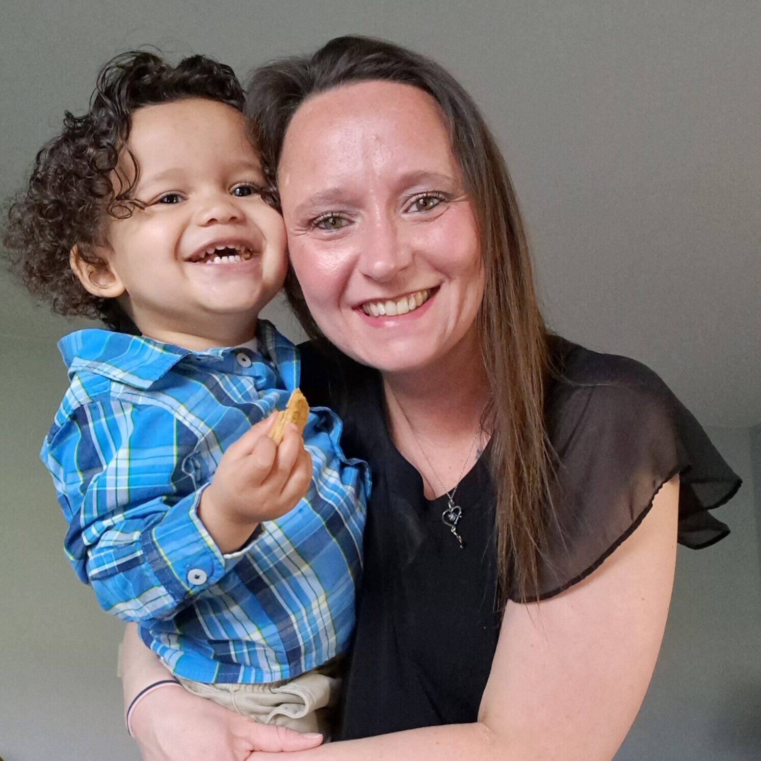 Woman holding small child