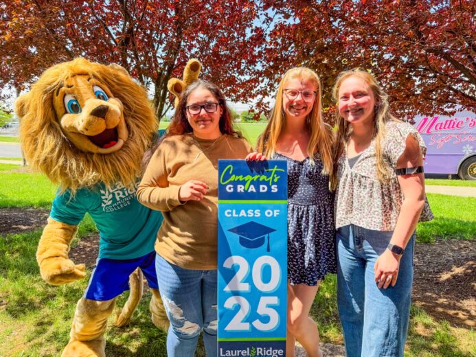 Students holding "Class of 2025" sign