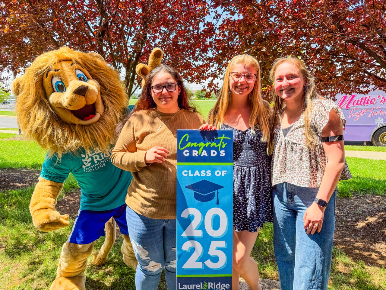 Students holding "Class of 2025" sign