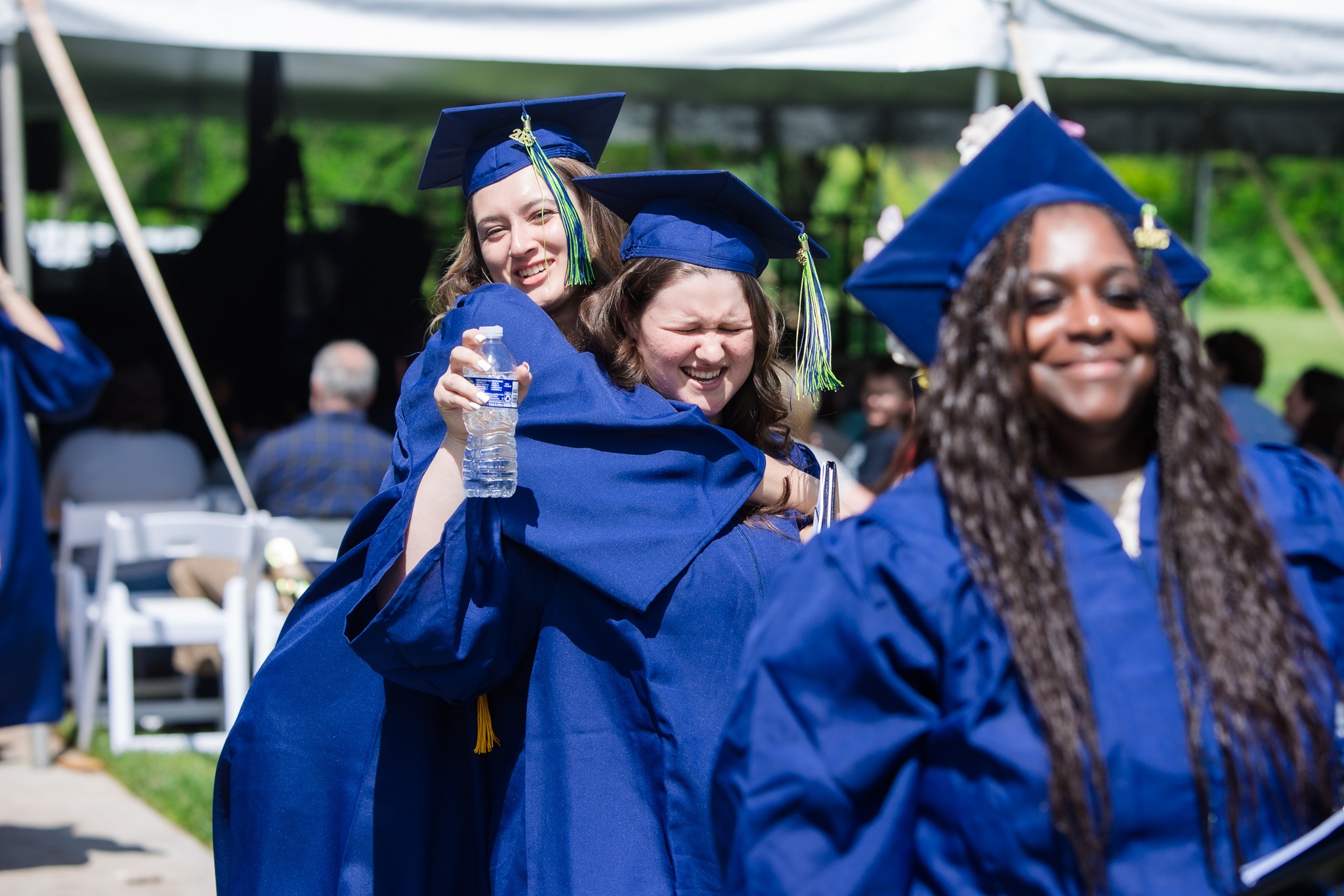 Graduates hugging
