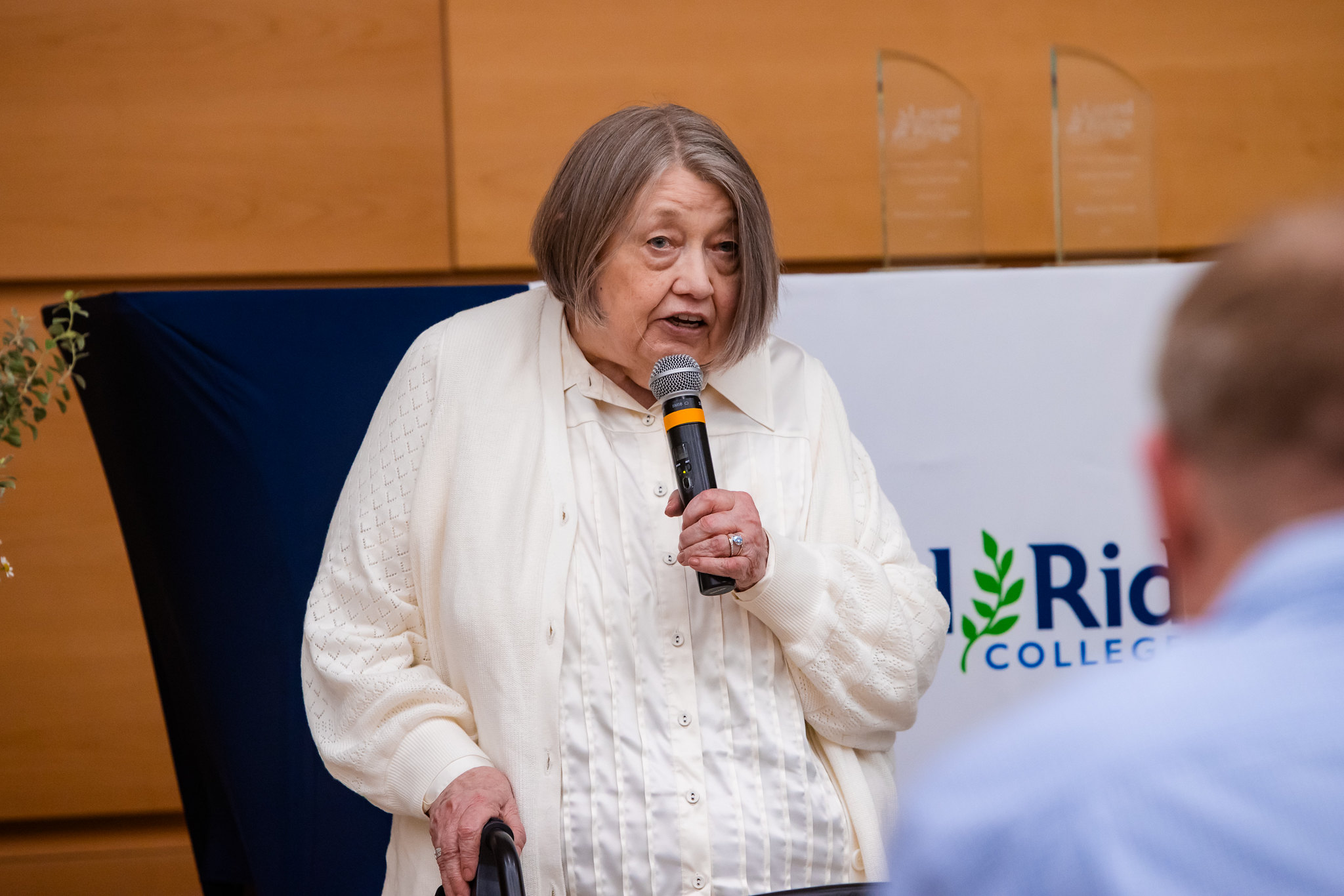 Lady talking into microphone