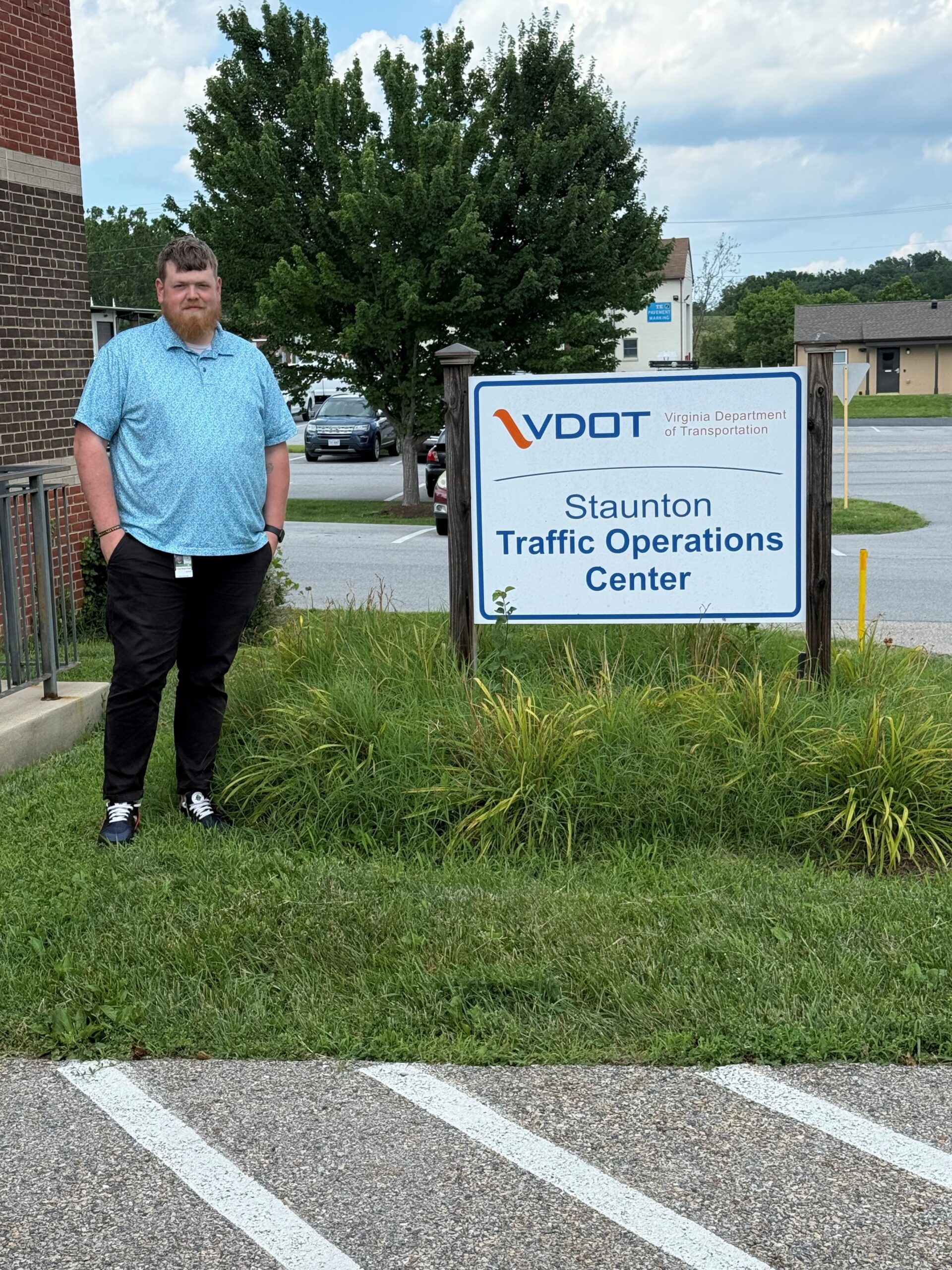 Caudle standing beside VDOT sign