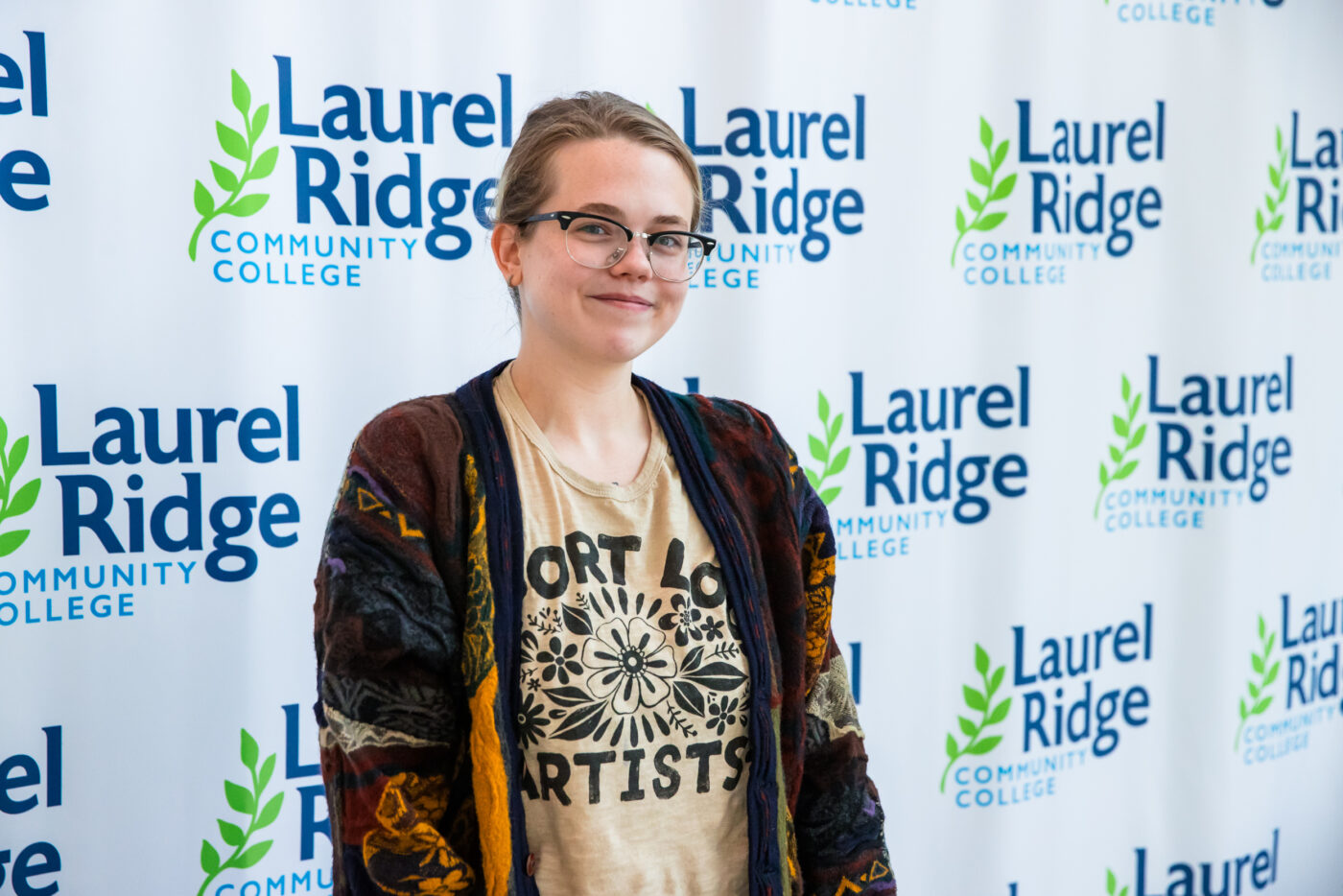 Image of Layman standing in front of a Laurel Ridge backdrop
