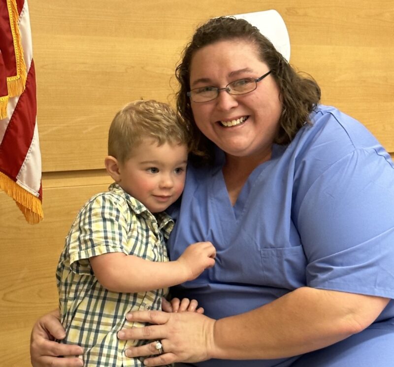a photograph of a young boy giving his mother a hug