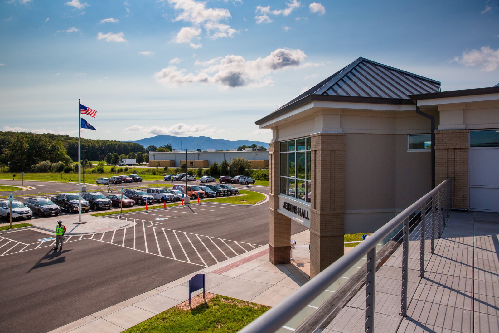 The outside of Jenkins Hall Building showing a mountain landscape in the background