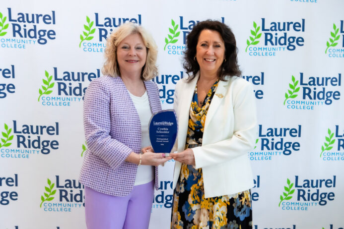 President Kim Blosser stands with alumni award winner Cynthia Schneider