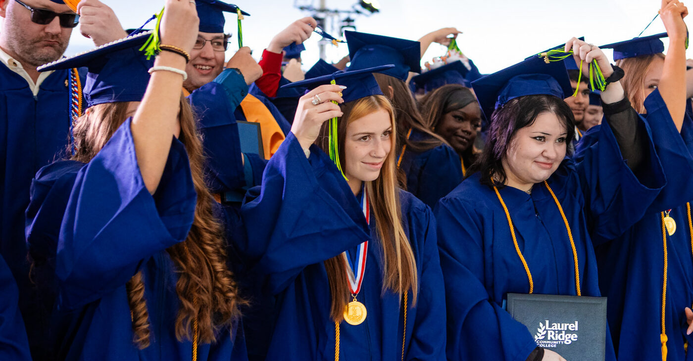 graduates move their tassels at the end of the ceremony