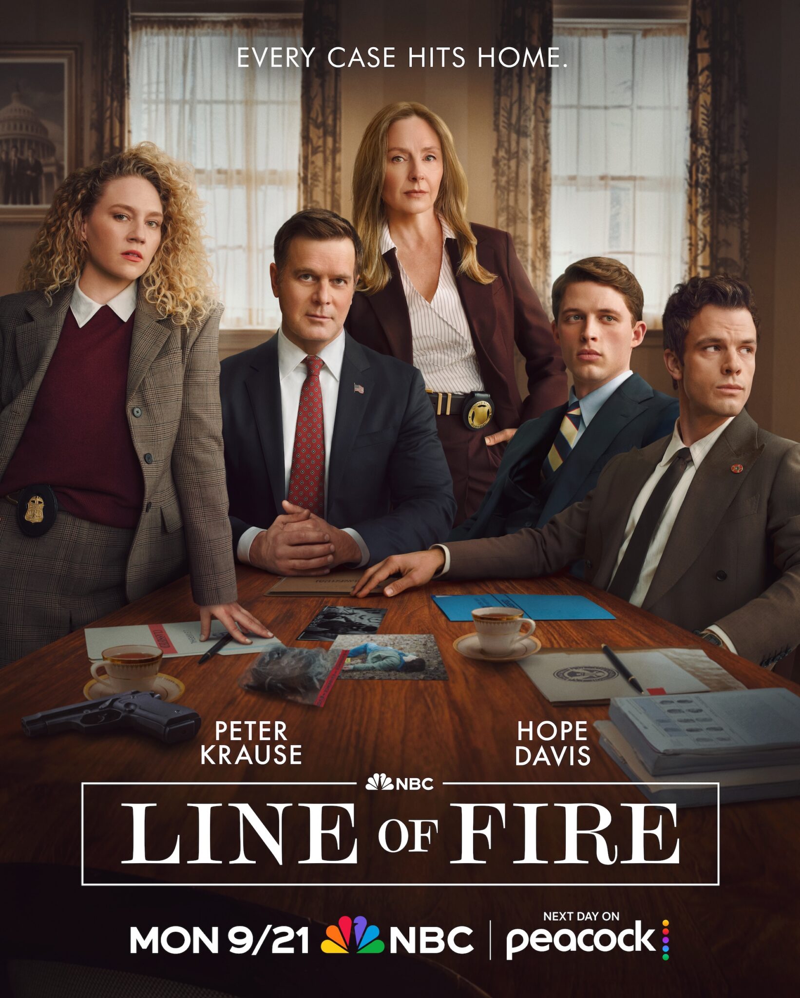 Promotional poster for NBC's Line of Fire featuring five investigators gathered around a conference table with case files, photos, a handgun, and coffee cups. Text reads “Every Case Hits Home” and promotes the series premiere on NBC and Peacock.